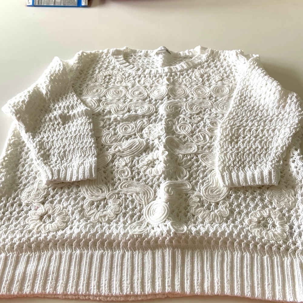 Like new. White loose knit sweater.